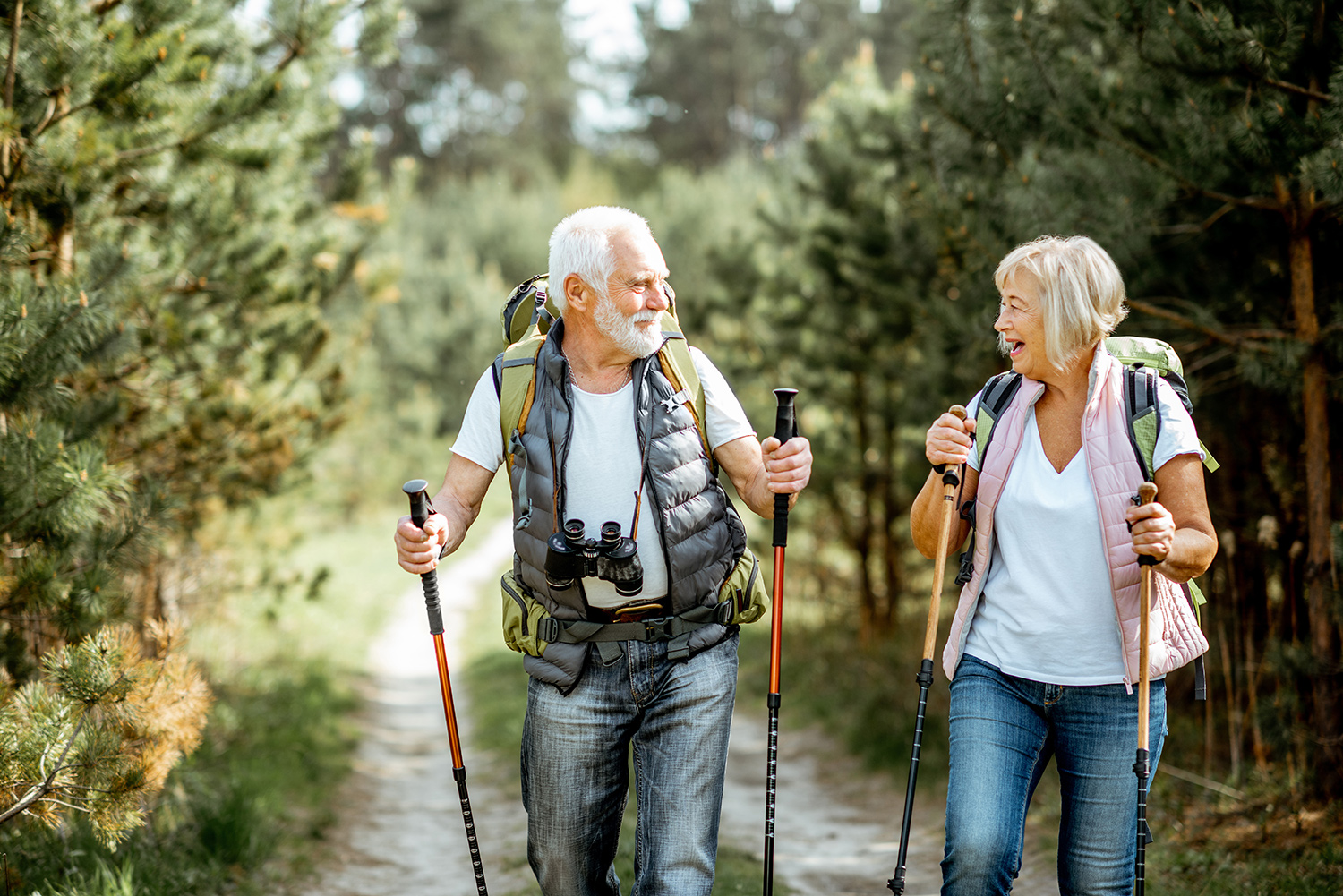 retired couple walking in nature